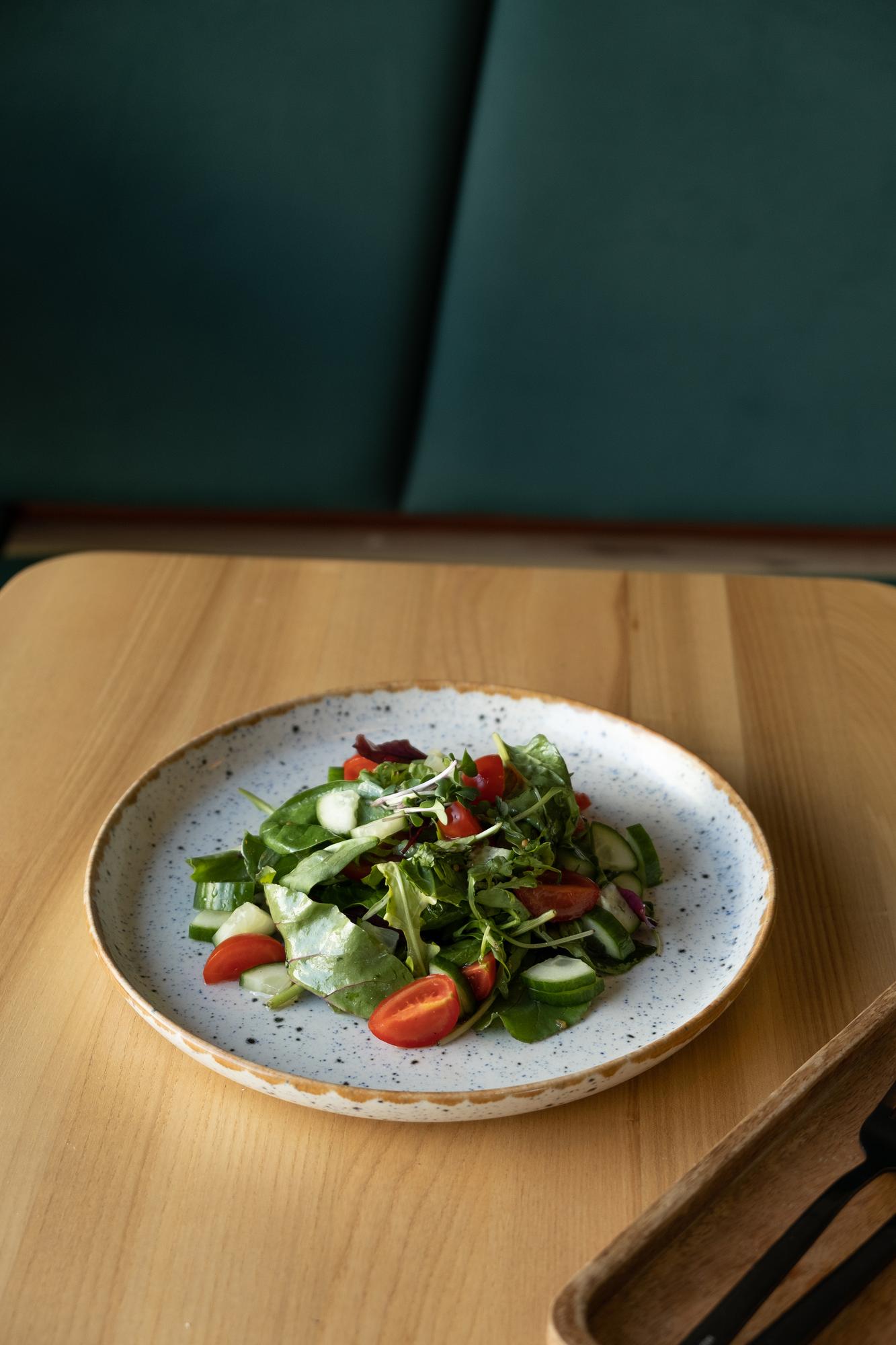 Plated seasonal salad on clean plate